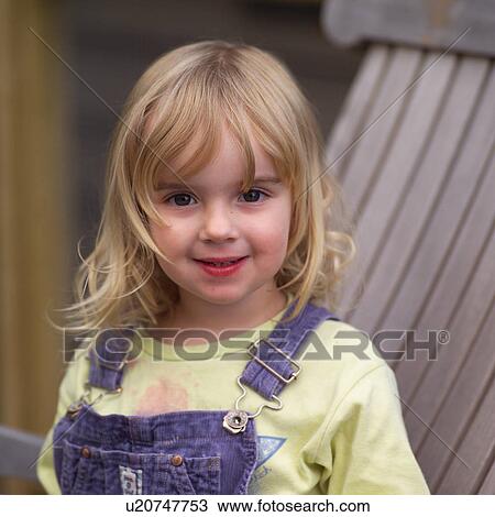 Portrait of a young girl looking at camera View Large Photo Image Stock Image - Portrait of a young girl looking at camera. Fotosearch