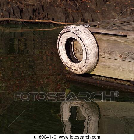 Wooden dock in the water View Large Photo Image Stock Image - Wooden dock in the water. Fotosearch