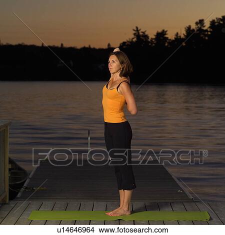 Adult female doing yoga View Large Photo Image Picture - Adult female doing yoga. Fotosearch