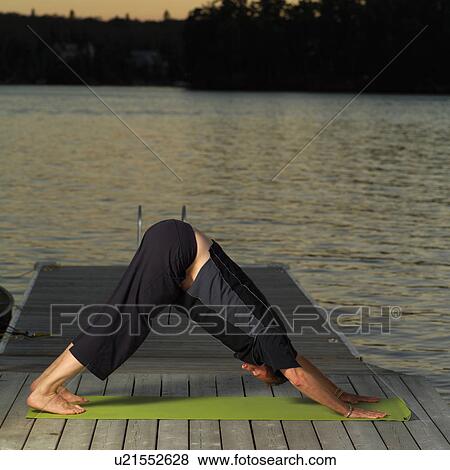 Adult male doing yoga View Large Photo Image Stock Photo - Adult male doing yoga. Fotosearch