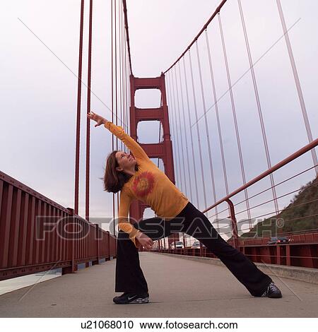 Golden Gate Bridge with woman doing yoga View Large Photo Image Stock Image - Golden Gate Bridge with woman doing yoga. Fotosearch