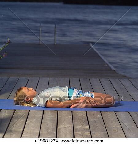 Picture - Teenage girl doing yoga. Fotosearch