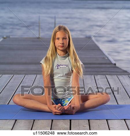 Stock Photo - Teenage girl doing yoga. Fotosearch