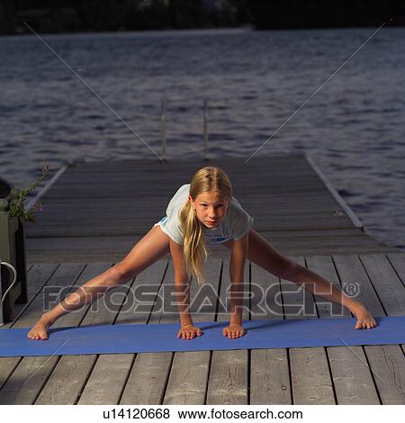 Stock Photo - Teenage girl doing yoga. Fotosearch