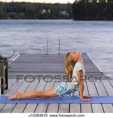 Teenage girl doing yoga View Large Photo Image Stock Photograph - Teenage girl doing yoga. Fotosearch