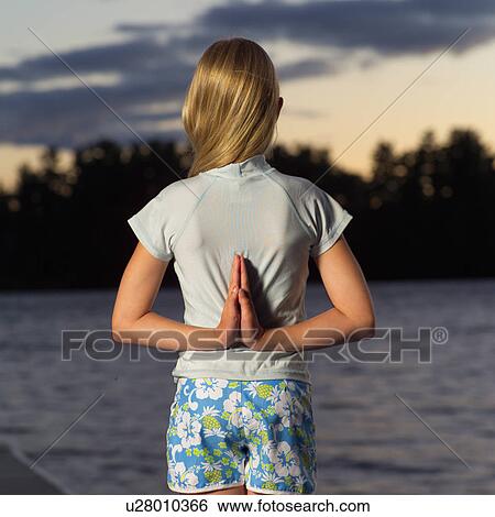 Stock Photograph - Teenage girl doing yoga. Fotosearch