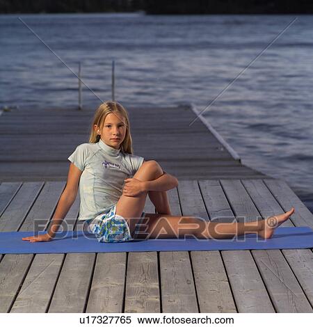Stock Photography - Teenage girl doing yoga. Fotosearch
