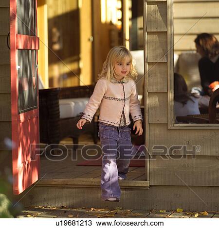 Blond child going through doorway View Large Photo Image Stock Image - Blond child going through doorway. Fotosearch