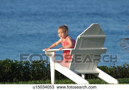 Stock Image - Child in chair. Fotosearch