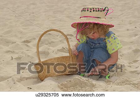Stock Photography - Child in the Sand. Fotosearch