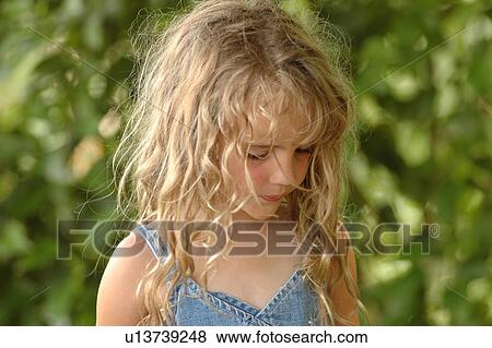 Stock Photo - Close-up of a young girl. Fotosearch