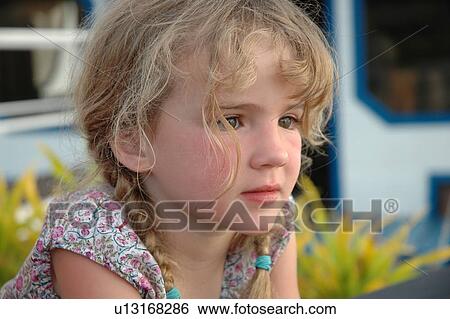 Close-up of a young girl View Large Photo Image Stock Photograph - Close-up of a young girl. Fotosearch