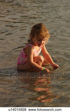 Kids playing on beach View Large Photo Image Stock Photo - Kids playing on beach. Fotosearch