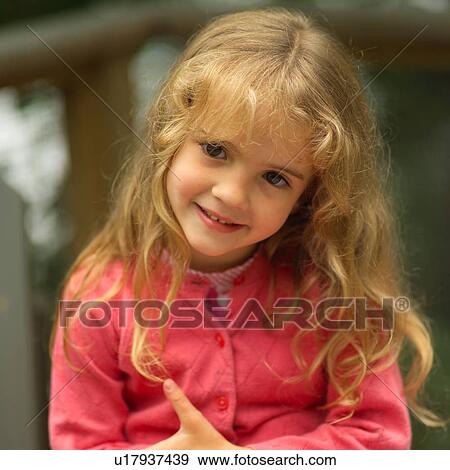 Portrait of a girl sitting outdoors View Large Photo Image Stock Photo - Portrait of a girl sitting outdoors. Fotosearch