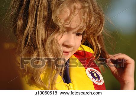 Stock Photo - Blond child in lifejacket. Fotosearch