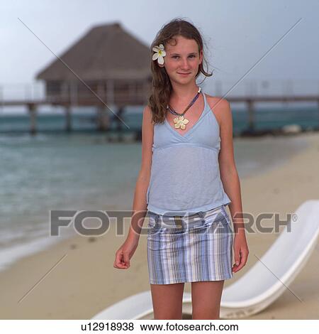 Brunette standing on beach at Moorea in Tahiti View Large Photo Image Stock Photo - Brunette standing on beach at Moorea in Tahiti. Fotosearch