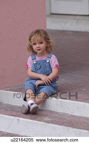 Child sitting on stairs View Large Photo Image Stock Photography - Child sitting on stairs. Fotosearch