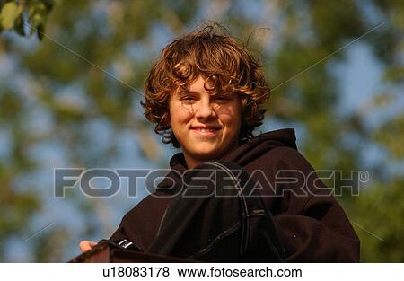 Portrait of a young boy looking at camera View Large Photo Image Stock Photo - Portrait of a young boy looking at camera. Fotosearch