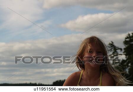 Picture - Portrait of a young girl smiling. Fotosearch