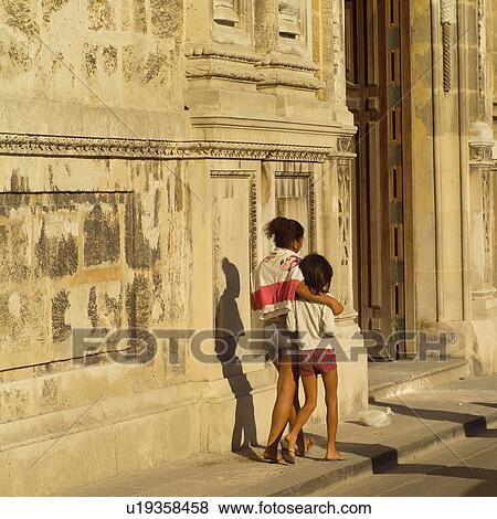 Rear view of two girls walking on a sidewalk, Havana, Cuba View Large Photo Image Stock Photo - Rear view of two girls walking on a sidewalk, Havana, Cuba. Fotosearch