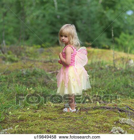Young girl in a fairy costume standing in the wilderness View Large Photo Image Stock Photo - Young girl in a fairy costume standing in the wilderness. Fotosearch