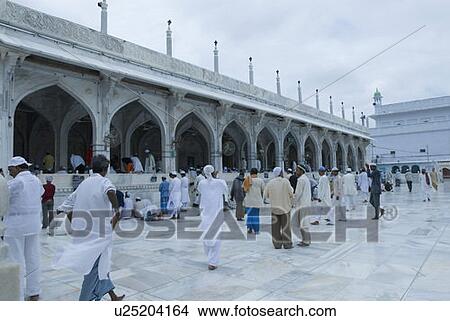 Picture - Group of people in the courtyard of a dargah, Ajmer Shriff, Rajasthan, India. Fotosearch