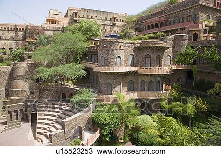 Stock Image - Trees around a fort, Neemrana Fort Palace, Neemrana, Alwar, Rajasthan, India. Fotosearch