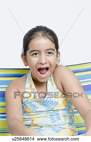 Close-up of a girl with mouth open View Large Photo Image Picture - Close-up of a girl with mouth open. Fotosearch