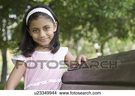 Portrait of a girl smirking View Large Photo Image Picture - Portrait of a girl smirking. Fotosearch