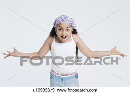 Stock Photo - Portrait of a girl with her arms outstretched. Fotosearch