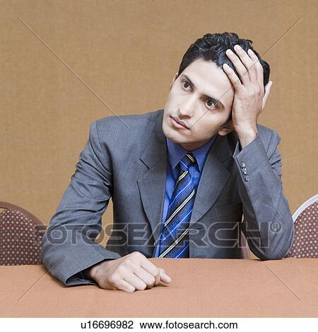 Close-up of a businessman looking serious View Large Photo Image Stock Image - Close-up of a businessman looking serious. Fotosearch