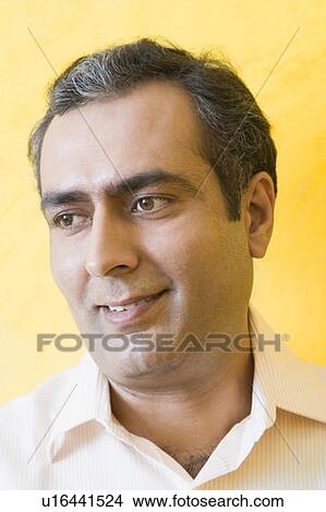 Picture - Close-up of a mid adult man smiling. Fotosearch