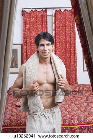Stock Image - Portrait of a young man smiling. Fotosearch