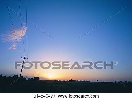 Stock Photo - Light, Electricity Pylon, Scenics, Twilight, Clear Sky. Fotosearch