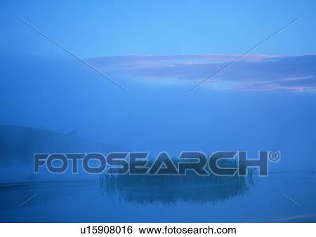 Stock Photograph - Outdoor, Foggy, Twilight, Lake, Dusk, Haze, Travel Destinations. Fotosearch
