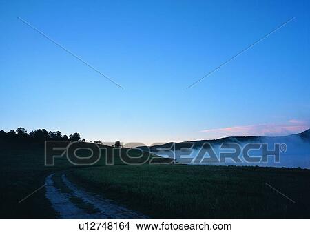 Outdoor, Sunlight, Dirt Road, Coast, Dusk, Light View Large Photo Image Picture - Outdoor, Sunlight, Dirt Road, Coast, Dusk, Light. Fotosearch