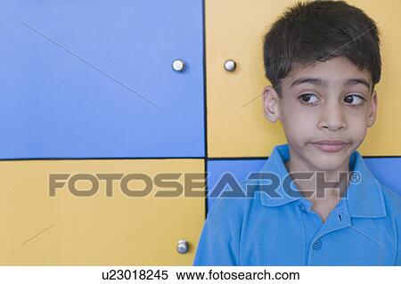 Close-up of a boy making a face View Large Photo Image Stock Photography - Close-up of a boy making a face. Fotosearch