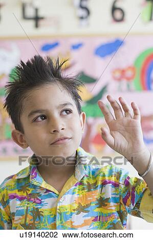 Close-up of a schoolboy looking up View Large Photo Image Stock Image - Close-up of a schoolboy looking up. Fotosearch