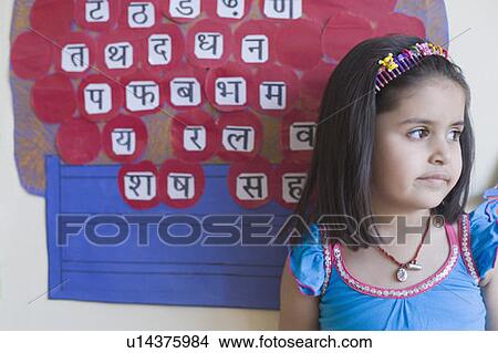 Close-up of a schoolgirl in front of a chart View Large Photo Image Picture - Close-up of a schoolgirl in front of a chart. Fotosearch