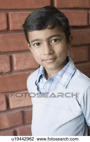 Stock Image - Portrait of a boy smirking. Fotosearch
