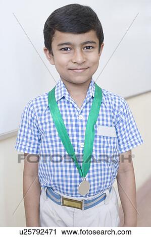 Portrait of a school boy with a medal around his neck View Large Photo Image Stock Image - Portrait of a school boy with a medal around his neck. Fotosearch