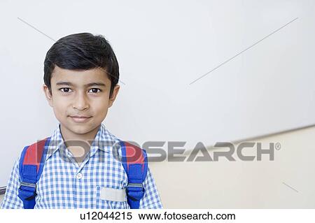 Stock Photography - Portrait of a schoolboy smiling. Fotosearch