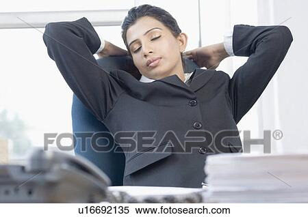Close-up of a businesswoman sleeping in an office View Large Photo Image Stock Photography - Close-up of a businesswoman sleeping in an office. Fotosearch