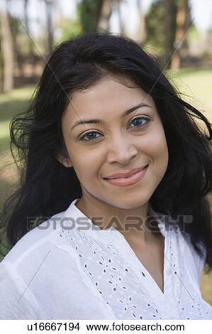 Picture - Portrait of a young woman smiling. Fotosearch