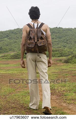 man carrying backpack