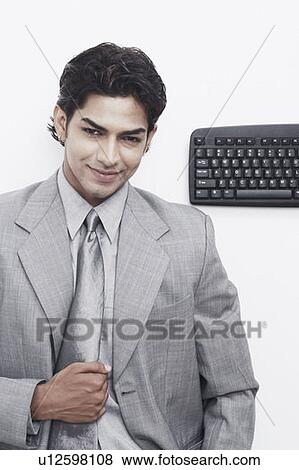 Portrait of a businessman smiling View Large Photo Image Stock Photo - Portrait of a businessman smiling. Fotosearch