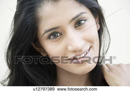 Stock Photo - Portrait of a young woman smiling. Fotosearch