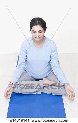 Pregnant woman practicing yoga View Large Photo Image Stock Image - Pregnant woman practicing yoga. Fotosearch