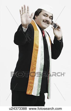 Portrait of a mature man talking on a mobile phone View Large Photo Image Stock Photo - Portrait of a mature man talking on a mobile phone. Fotosearch