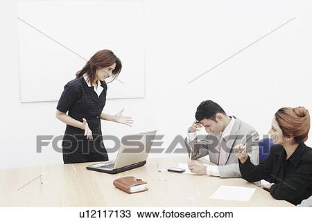 Businesswoman shouting at a businessman View Large Photo Image Stock Image - Businesswoman shouting at a businessman. Fotosearch
